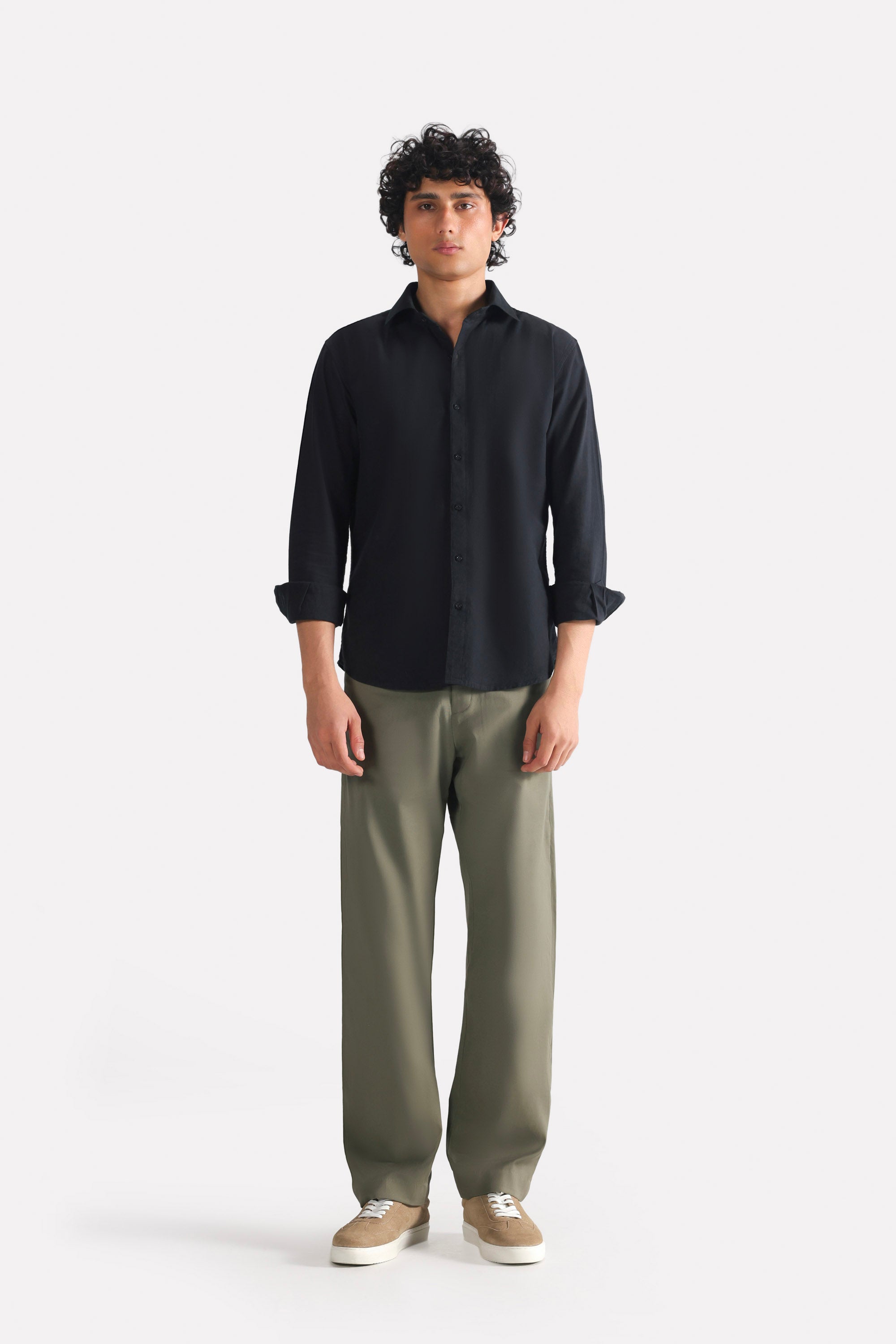 Dark olive straight fit cotton trouser, worn by a model, by SOLA Pakistan.