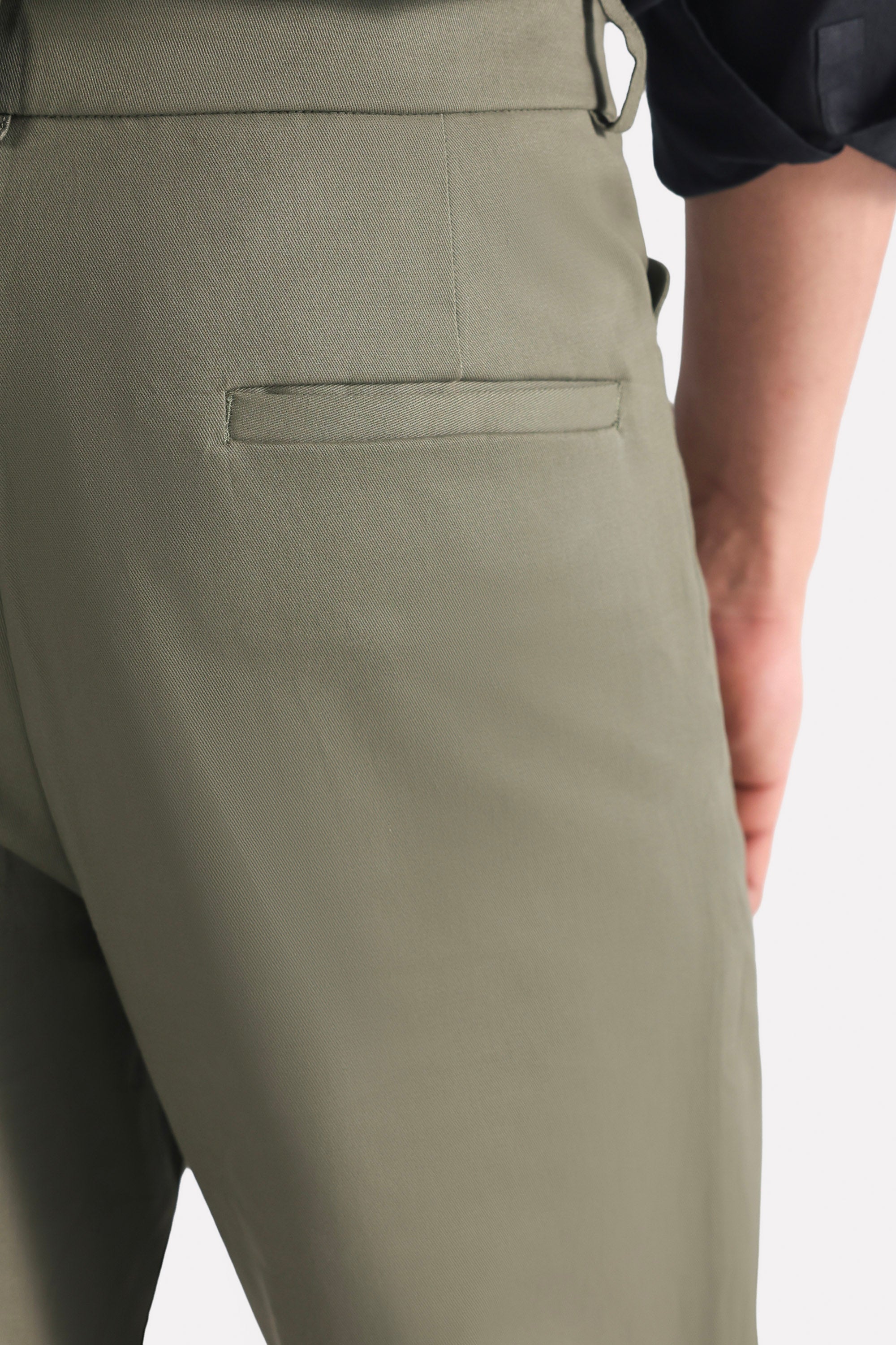 Dark olive straight fit cotton trouser shown in a styled fit, by SOLA Pakistan.