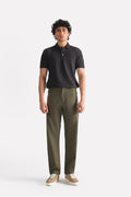 Dark olive straight fit dobby trouser in cotton, worn by a model, by SOLA Pakistan.