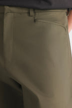Dark olive straight fit dobby trouser shown in a styled fit, by SOLA Pakistan.