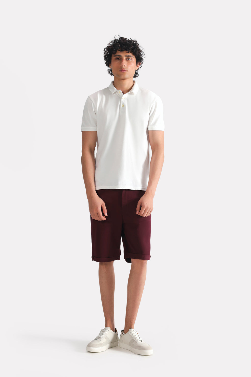Dark purple (plum) relaxed fit cotton shorts, worn by a model, by SOLA Pakistan.