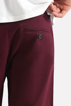 Dark purple (plum) relaxed fit cotton shorts shown in a styled fit, by SOLA Pakistan.