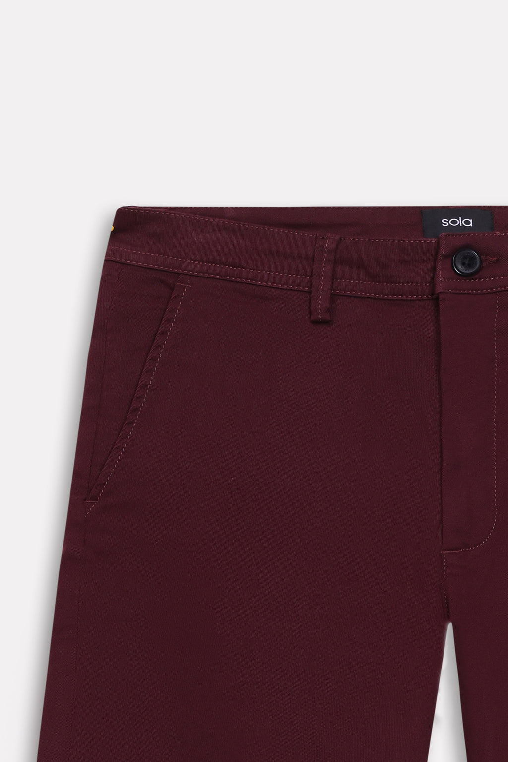 Texture and fabric detail, dark purple (plum) relaxed fit cotton shorts, by SOLA Pakistan.