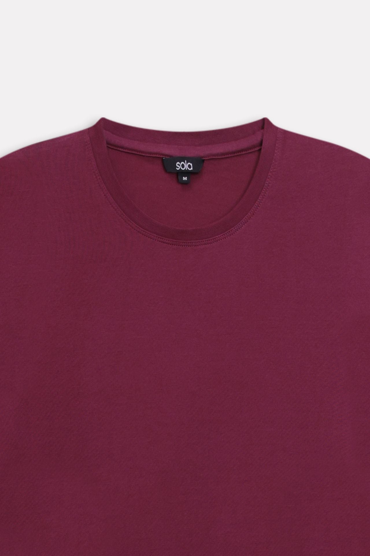 Texture and fabric detail, dark red (burgundy) regular fit crew neck t-shirt, by SOLA Pakistan.