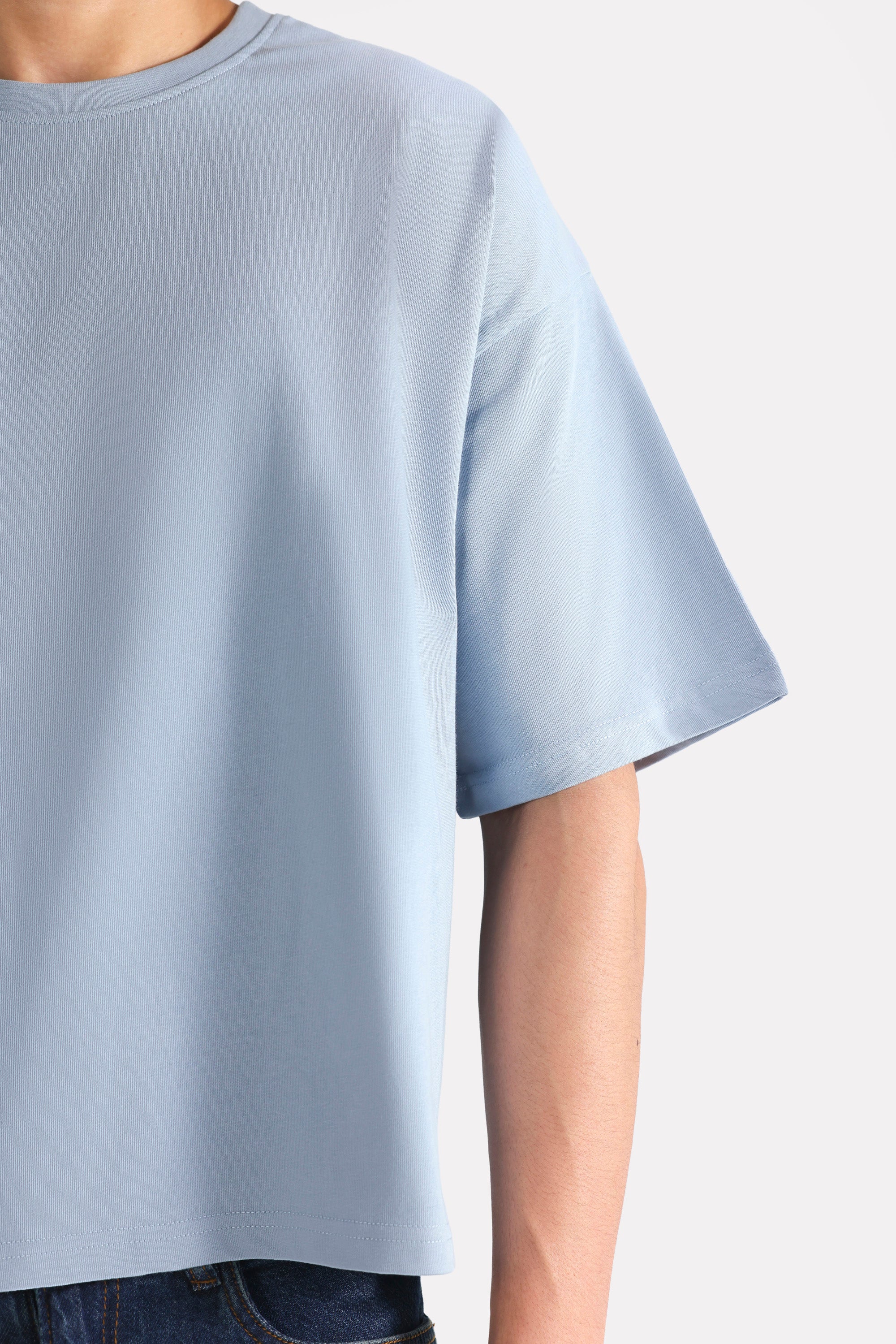 Faded blue (faded denim) drop shoulder cotton t-shirt, alternate angle, by SOLA Pakistan.
