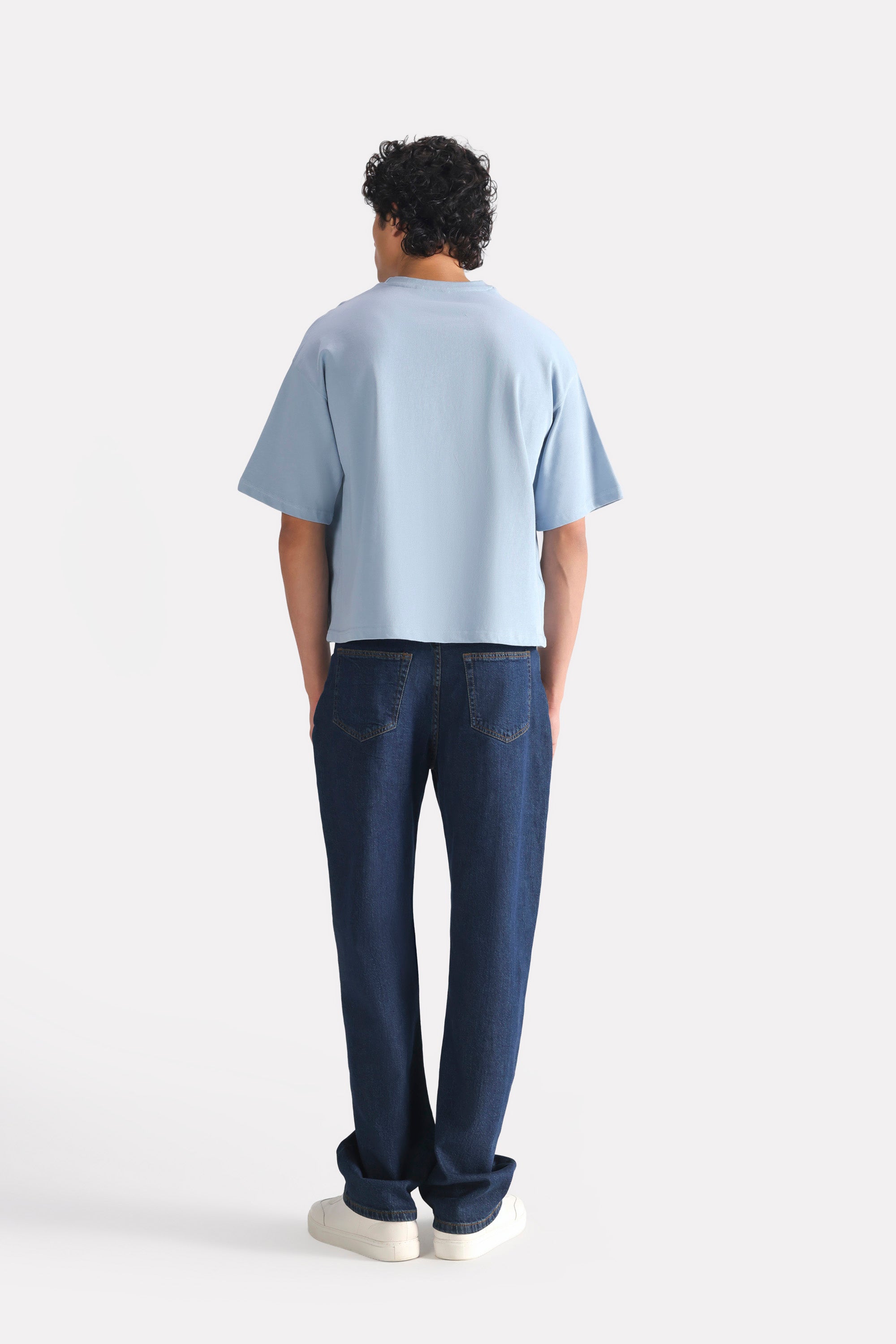 Flat lay of the faded blue (faded denim) drop shoulder cotton t-shirt, by SOLA Pakistan.