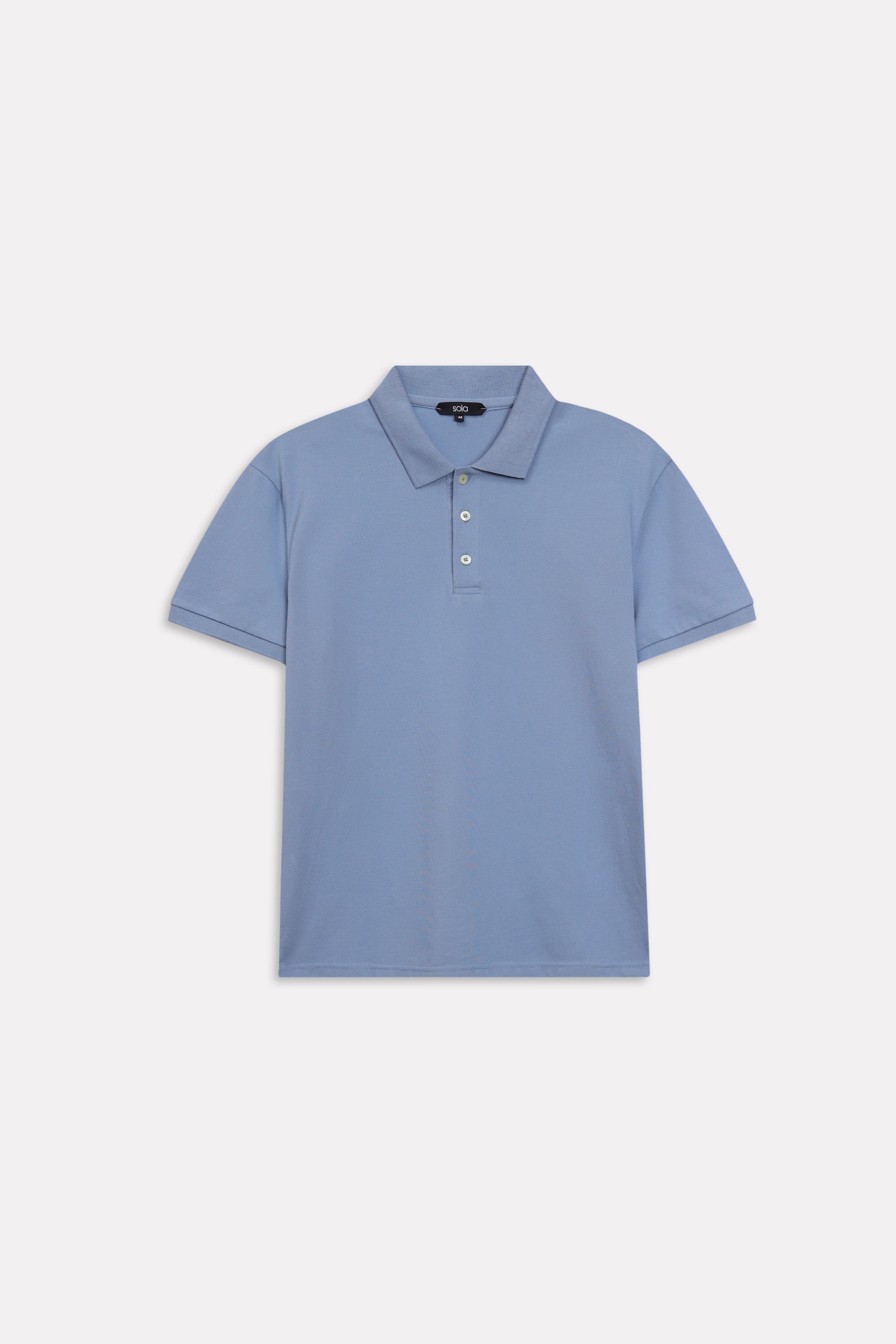 Flat lay of the faded blue (faded denim) micro-textured cotton pique polo, by SOLA Pakistan.
