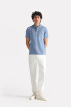 Faded blue (faded denim) micro-textured cotton pique polo shown in a styled fit, by SOLA Pakistan.