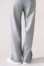 Close-up detail on the grey barrel-leg pleated trouser, by SOLA Pakistan.