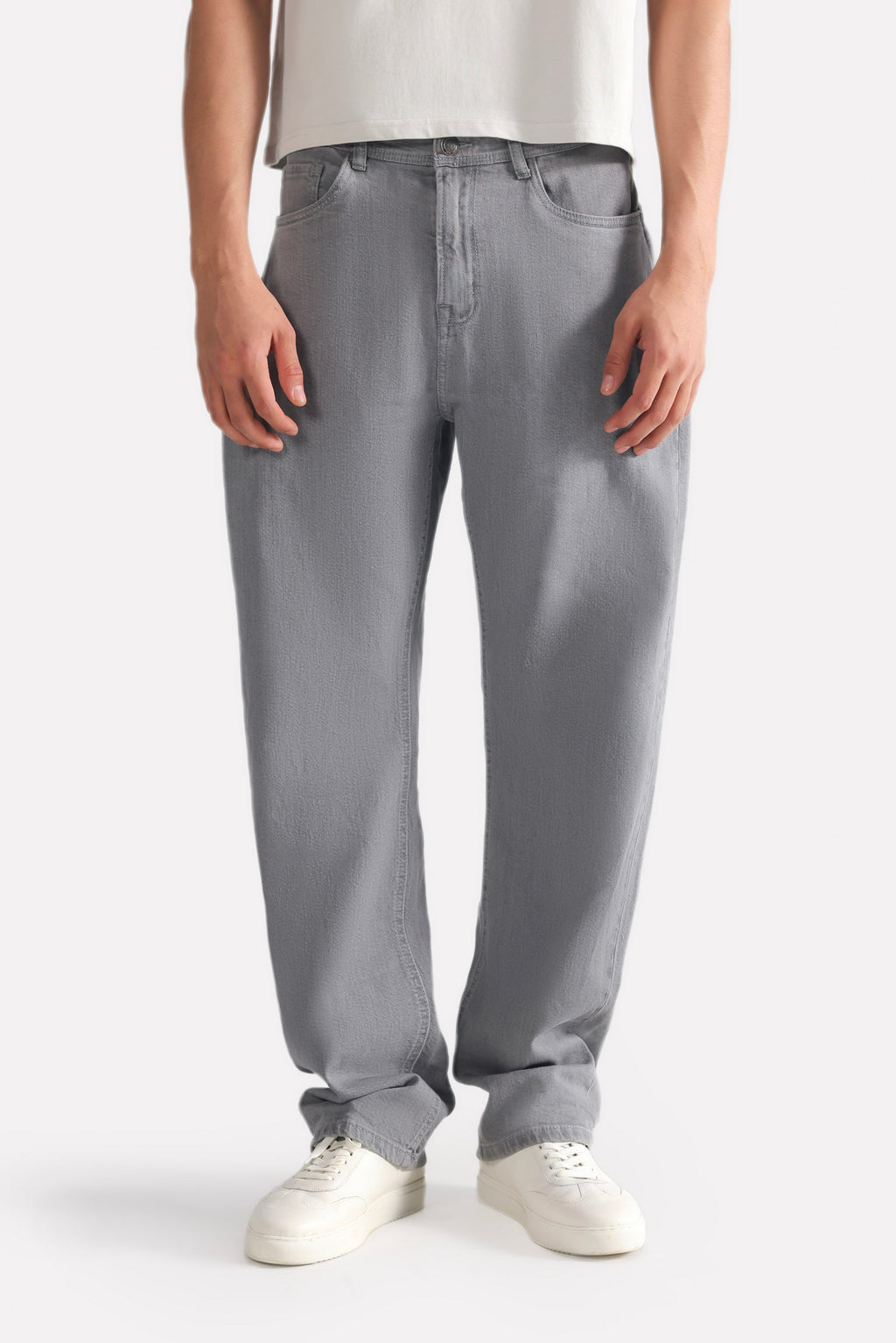 Close-up detail on the grey regular fit jean, by SOLA Pakistan.