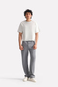 Grey regular fit jean in cotton, worn by a model, by SOLA Pakistan.