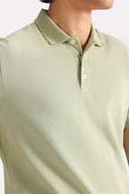 Khaki beige (faded khaki) micro-textured cotton pique polo shown in a styled fit, by SOLA Pakistan.