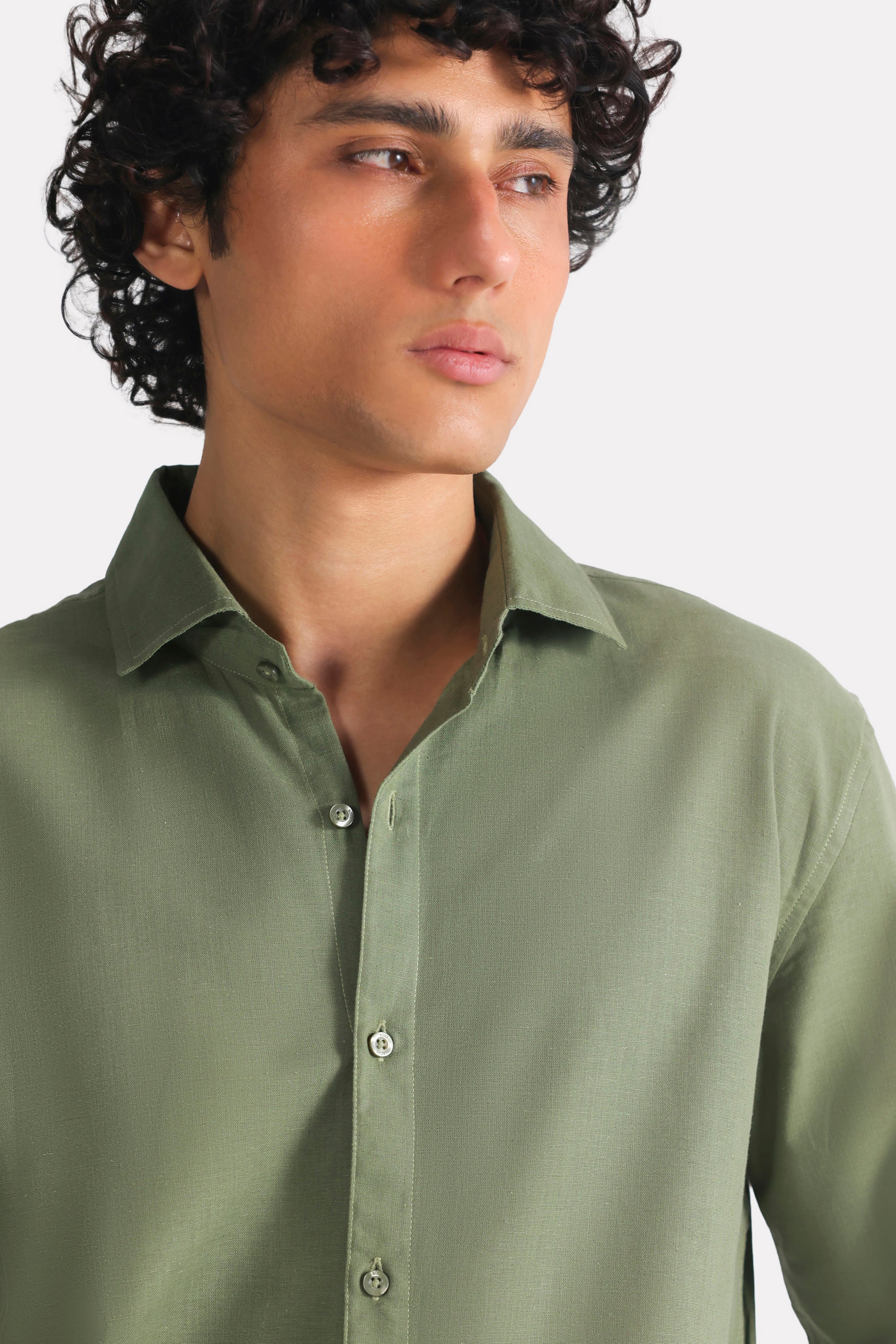 Flat lay of the khaki green relaxed cotline shirt, by SOLA Pakistan.