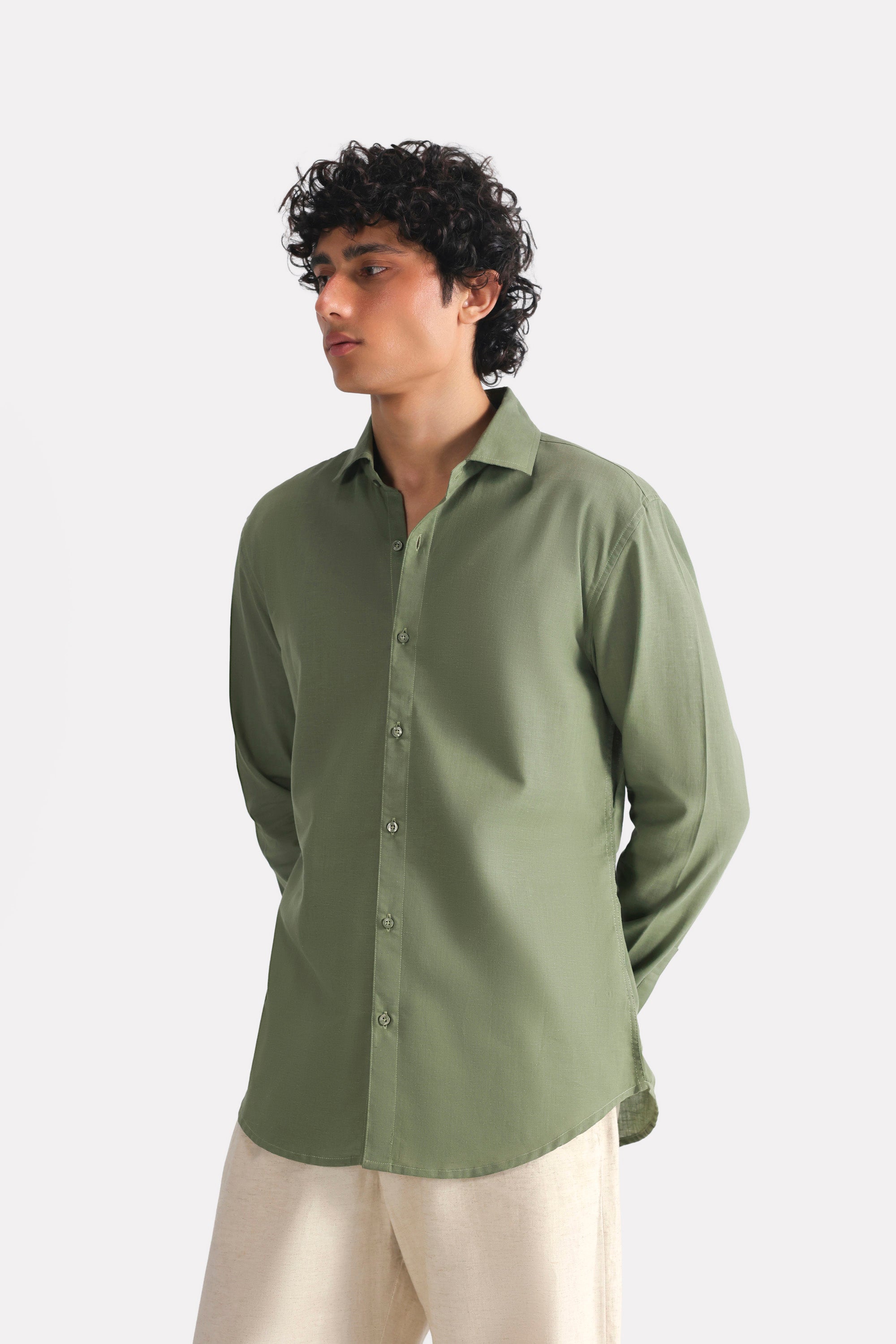 Khaki green relaxed cotline shirt in cotton-linen blend, worn by a model, by SOLA Pakistan.