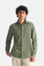 Khaki green relaxed cotline shirt shown in a styled fit, by SOLA Pakistan.