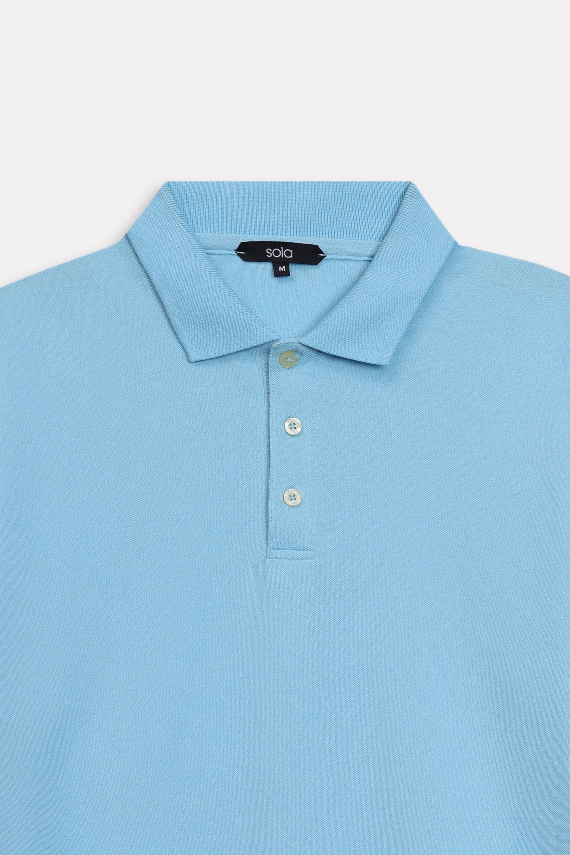 Additional view of the light blue micro-textured cotton pique polo, by SOLA Pakistan.