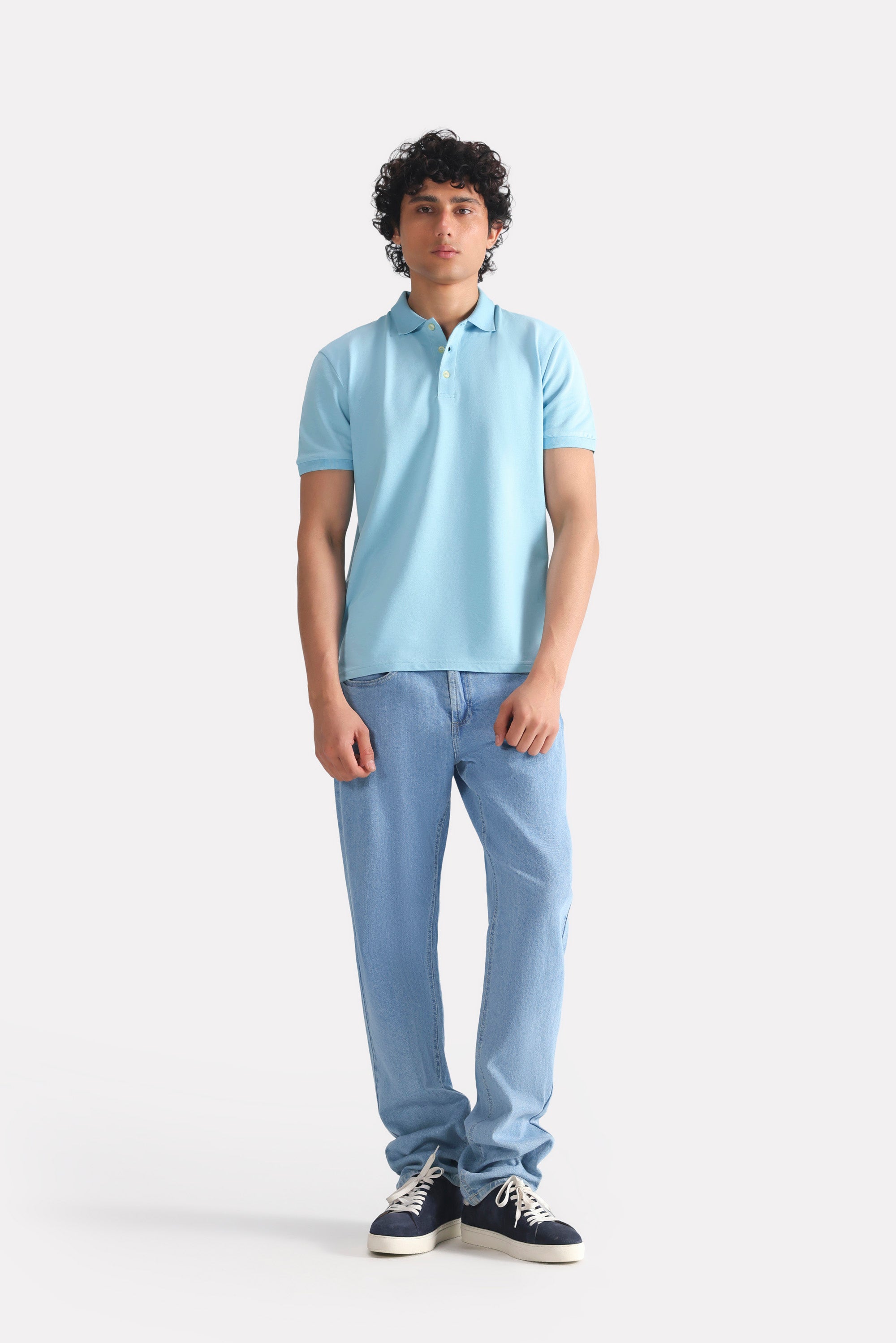 Light blue micro-textured cotton pique polo shown in a styled fit, by SOLA Pakistan.