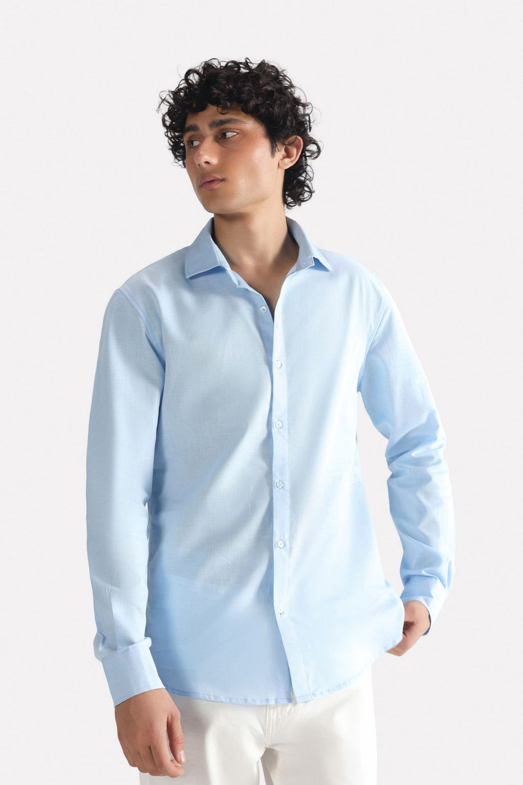 Light blue premium cotline shirt in cotton-linen blend, worn by a model, by SOLA Pakistan.