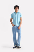 Light blue signature regular fit jeans in cotton, worn by a model, by SOLA Pakistan.