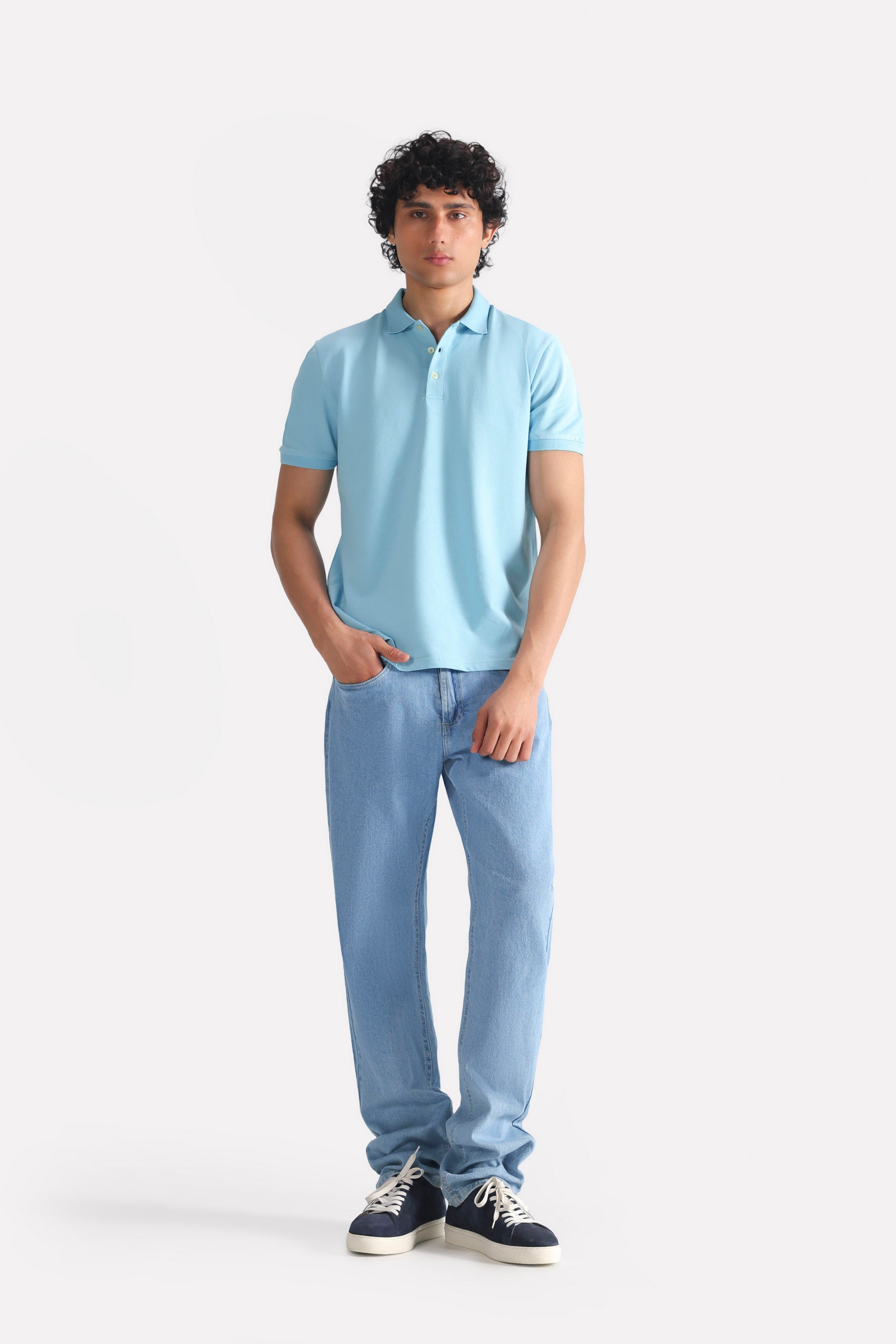 Light blue signature regular fit jeans in cotton, worn by a model, by SOLA Pakistan.