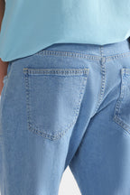 Light blue signature regular fit jeans shown in a styled fit, by SOLA Pakistan.