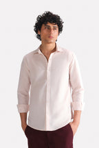 Light pink relaxed cotline shirt in cotton-linen blend, worn by a model, by SOLA Pakistan.