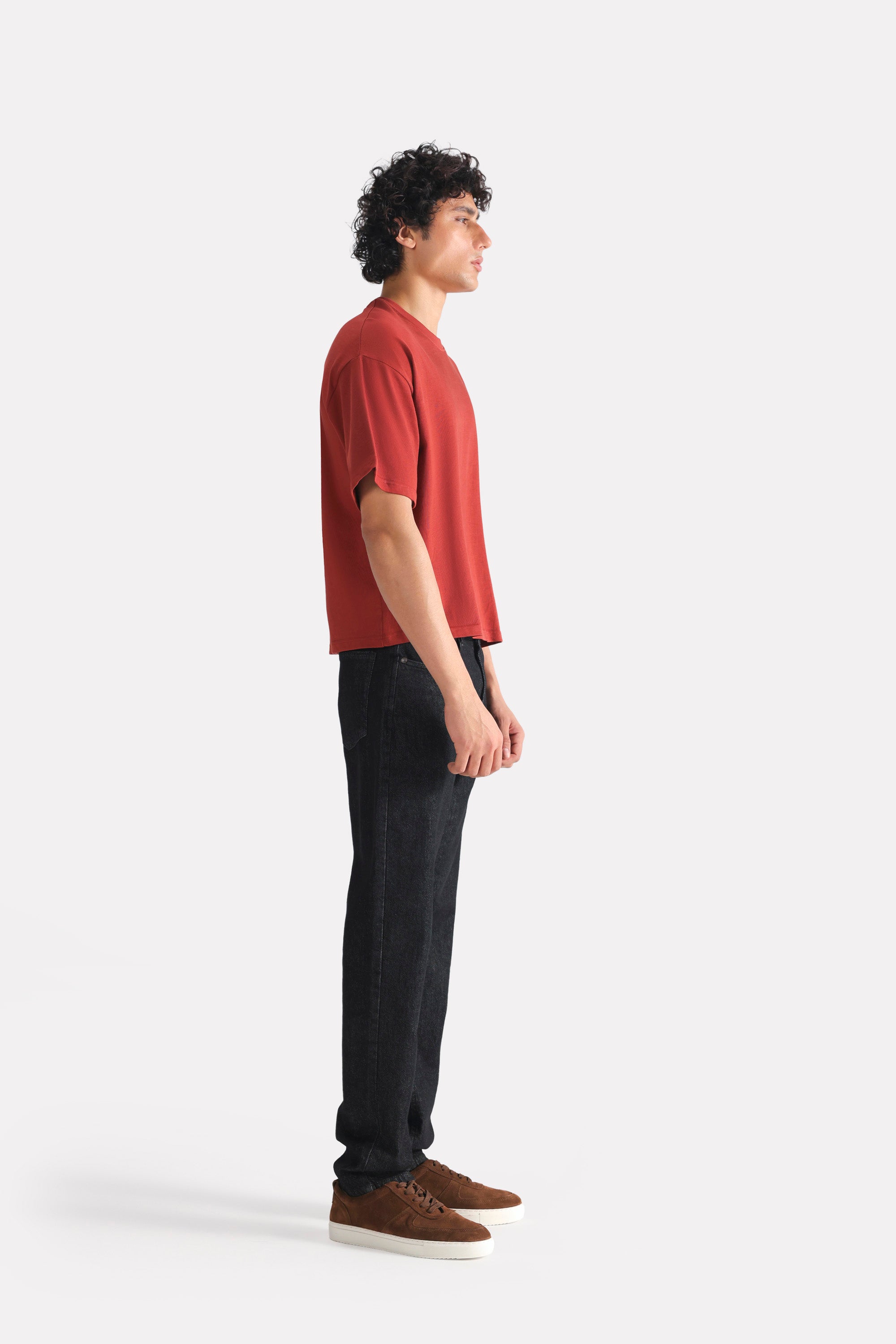 Close-up detail on the matt red drop shoulder cotton t-shirt, by SOLA Pakistan.