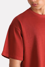 Matt red drop shoulder cotton t-shirt shown in a styled fit, by SOLA Pakistan.