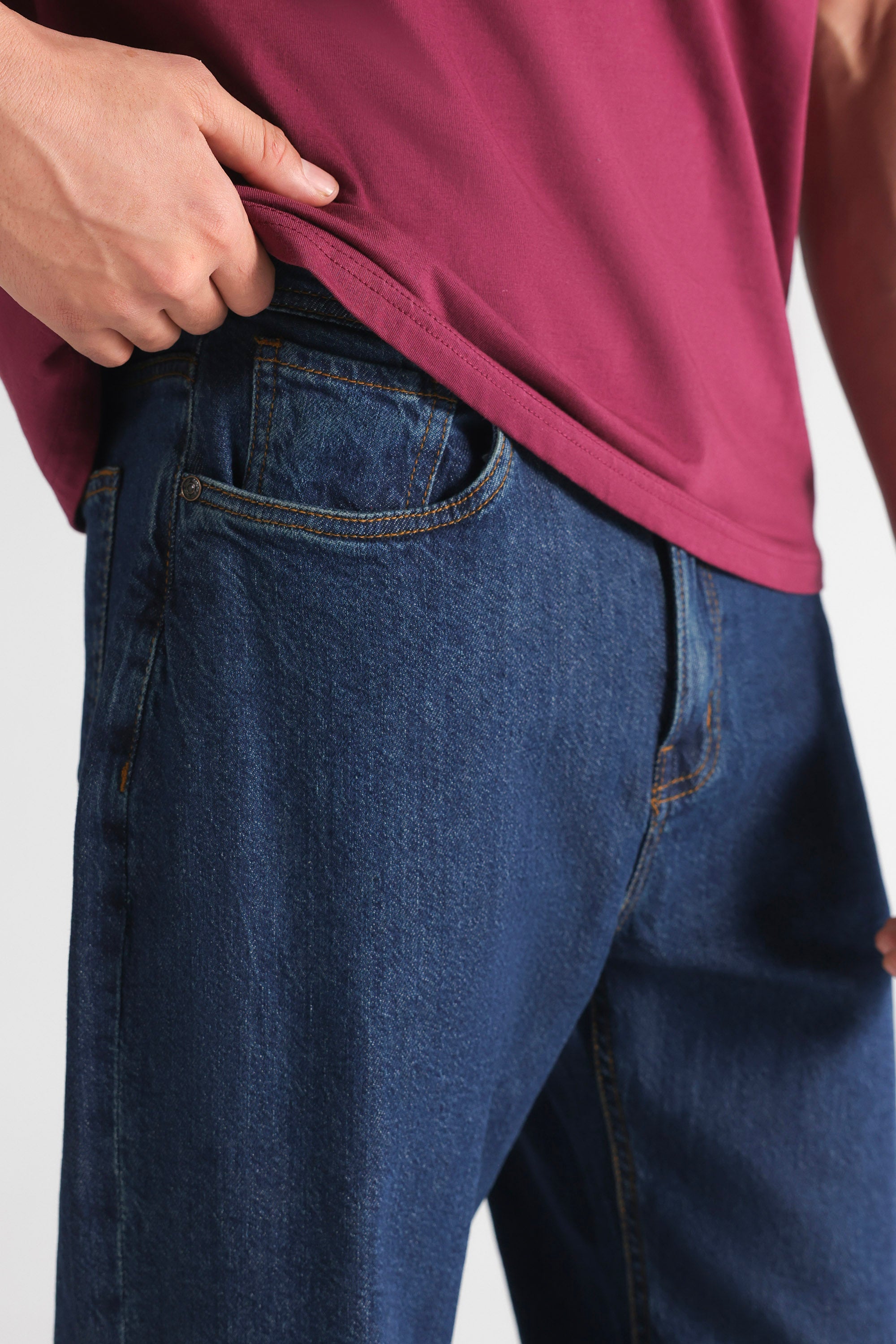 Close-up detail on the mid blue signature regular fit jeans, by SOLA Pakistan.