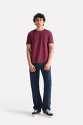 Mid blue signature regular fit jeans in cotton, worn by a model, by SOLA Pakistan.