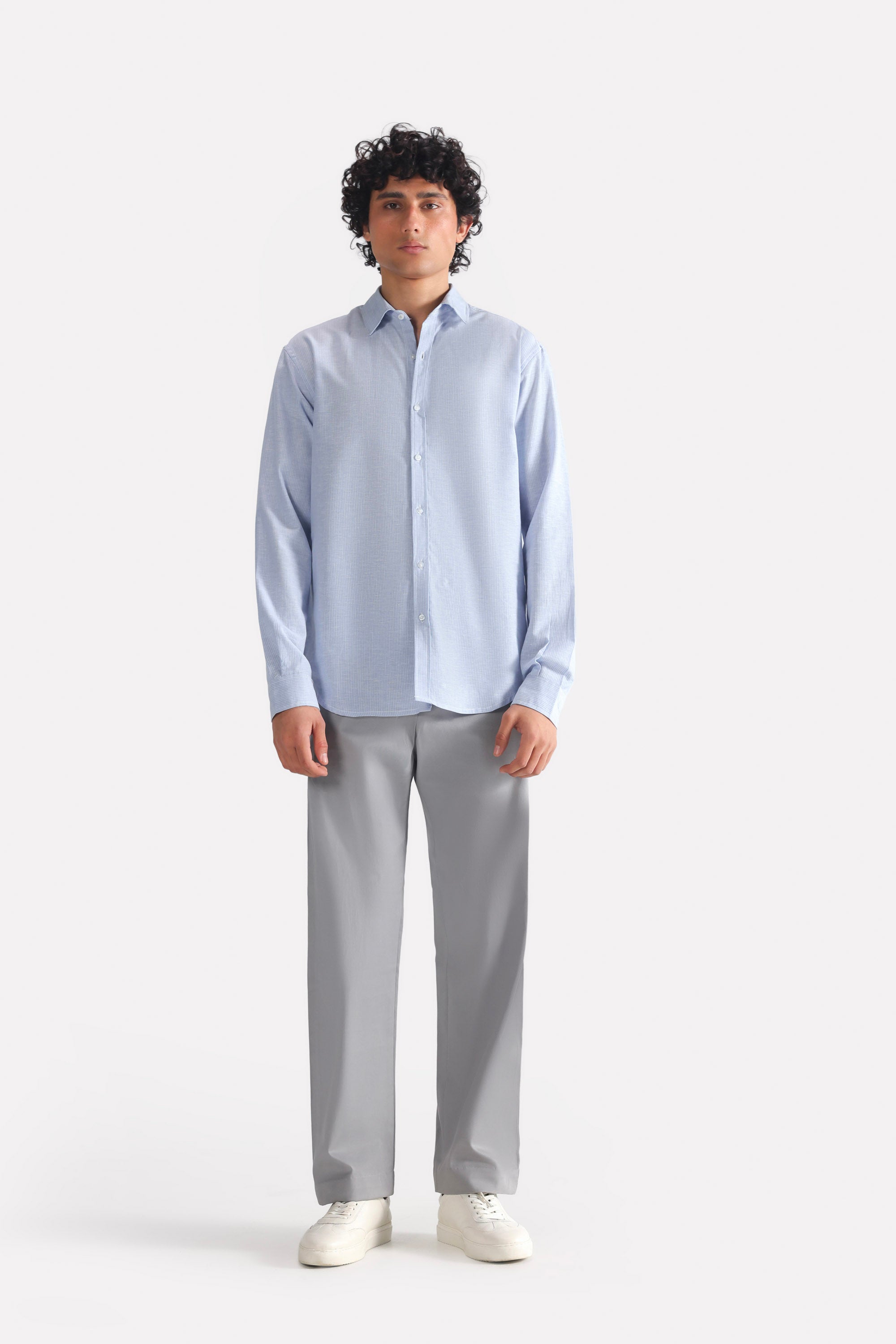 Mid grey straight fit cotton trouser, worn by a model, by SOLA Pakistan.