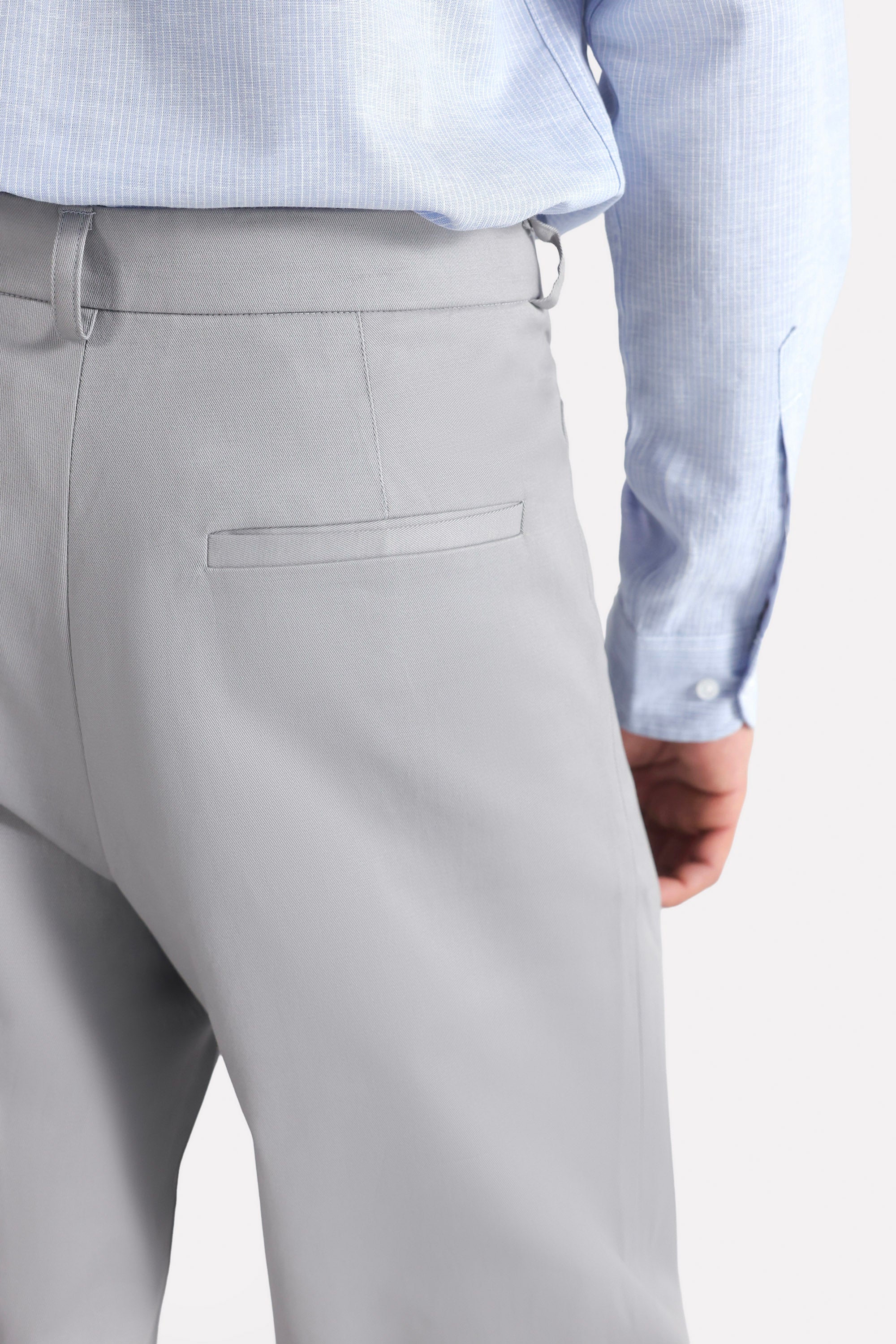 Mid grey straight fit cotton trouser shown in a styled fit, by SOLA Pakistan.