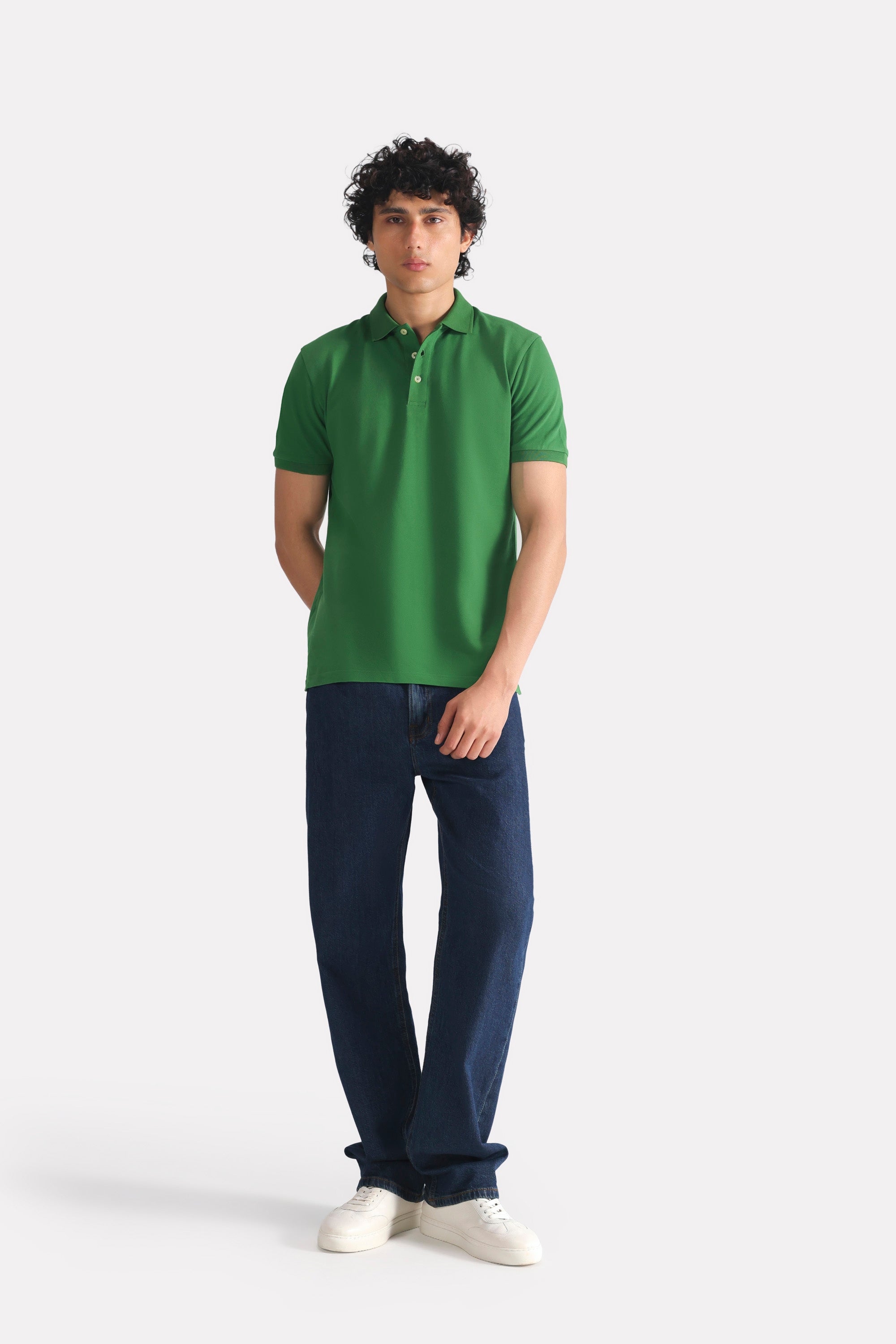 Moss green micro-textured cotton pique polo shown in a styled fit, by SOLA Pakistan.