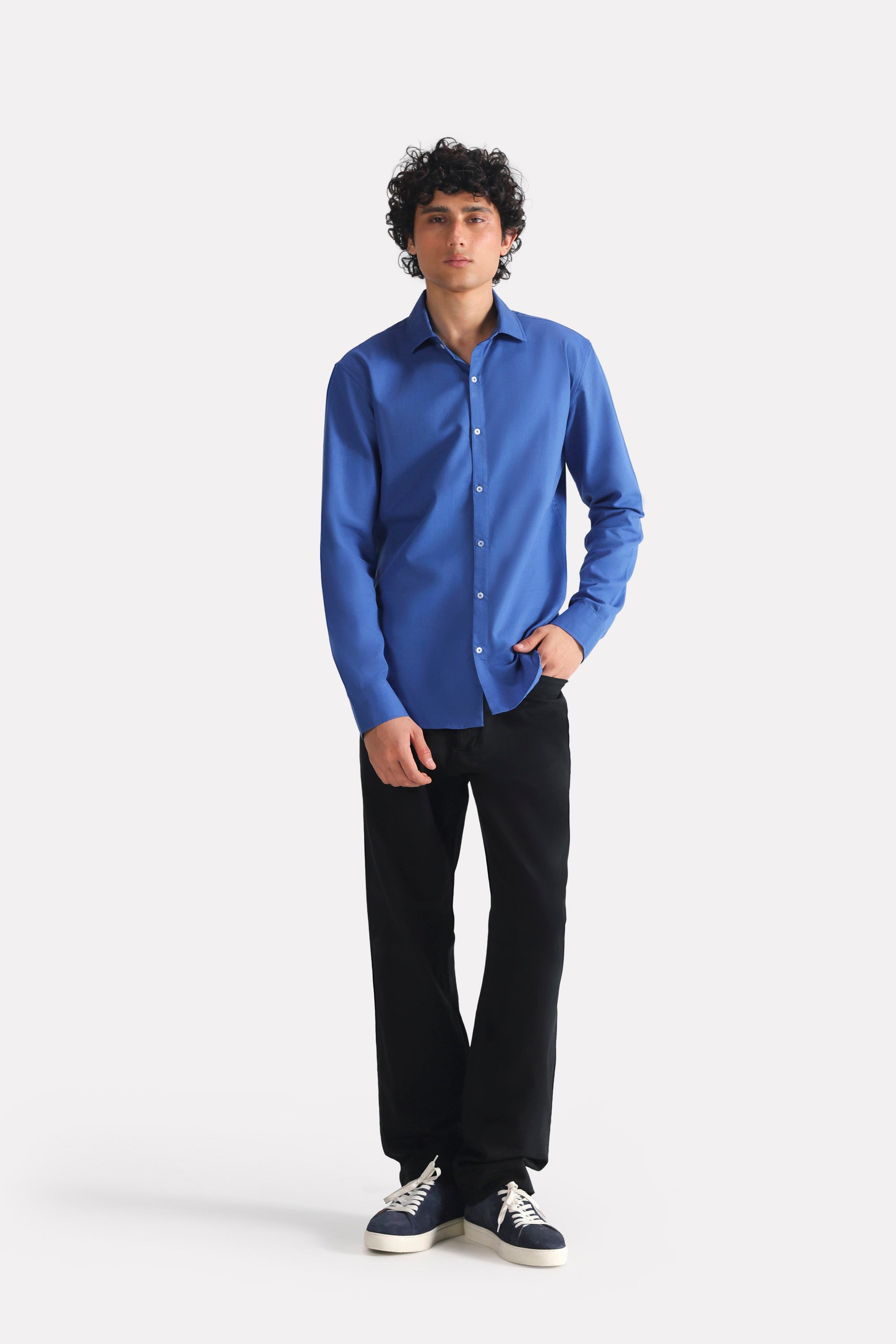 Close-up detail on the navy blue relaxed cotline shirt, by SOLA Pakistan.