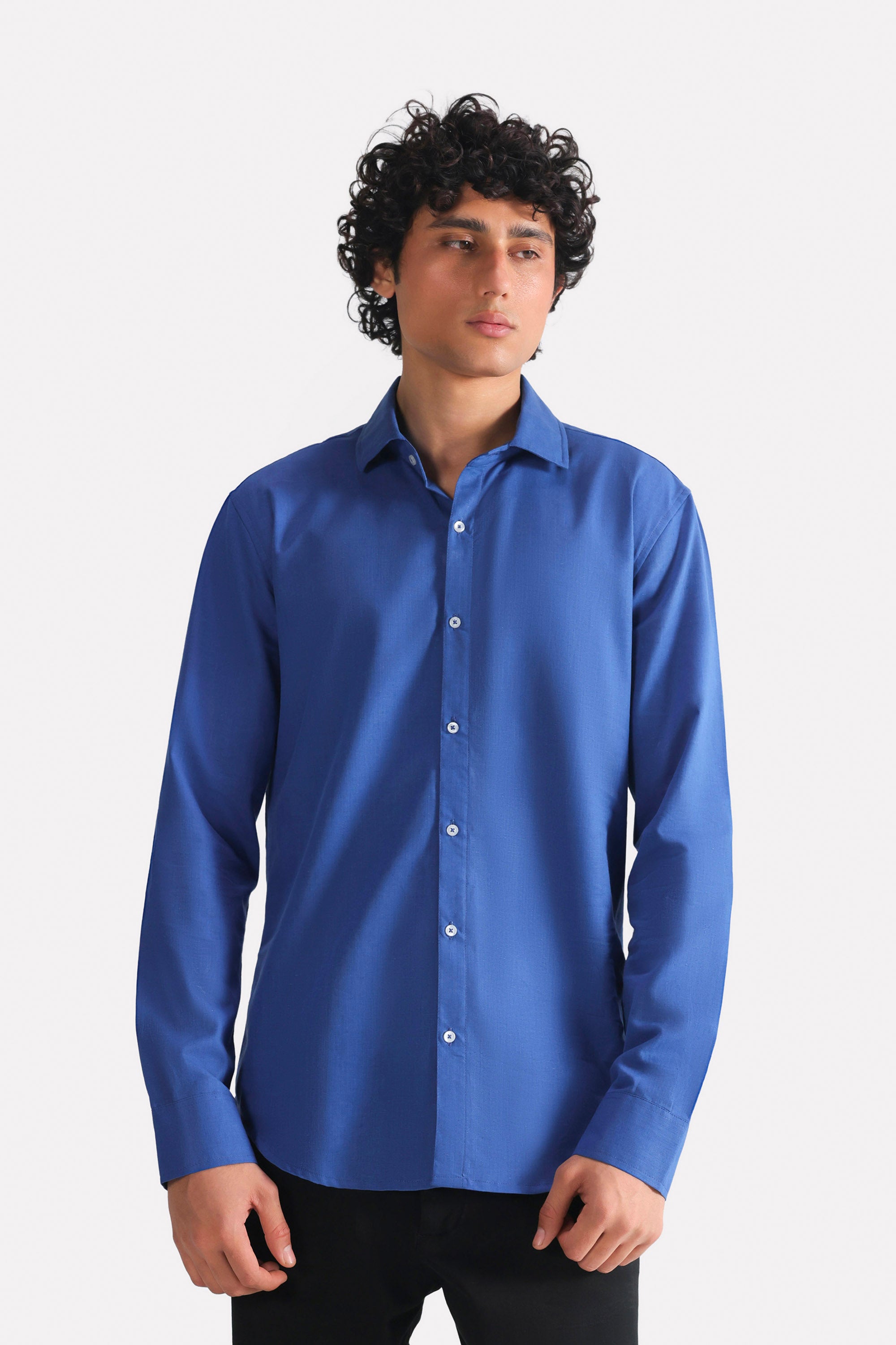 Navy blue relaxed cotline shirt in cotton-linen blend, worn by a model, by SOLA Pakistan.