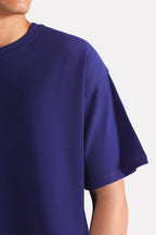 Flat lay of the navy drop shoulder cotton t-shirt, by SOLA Pakistan.