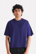 Navy drop shoulder cotton t-shirt, worn by a model, by SOLA Pakistan.