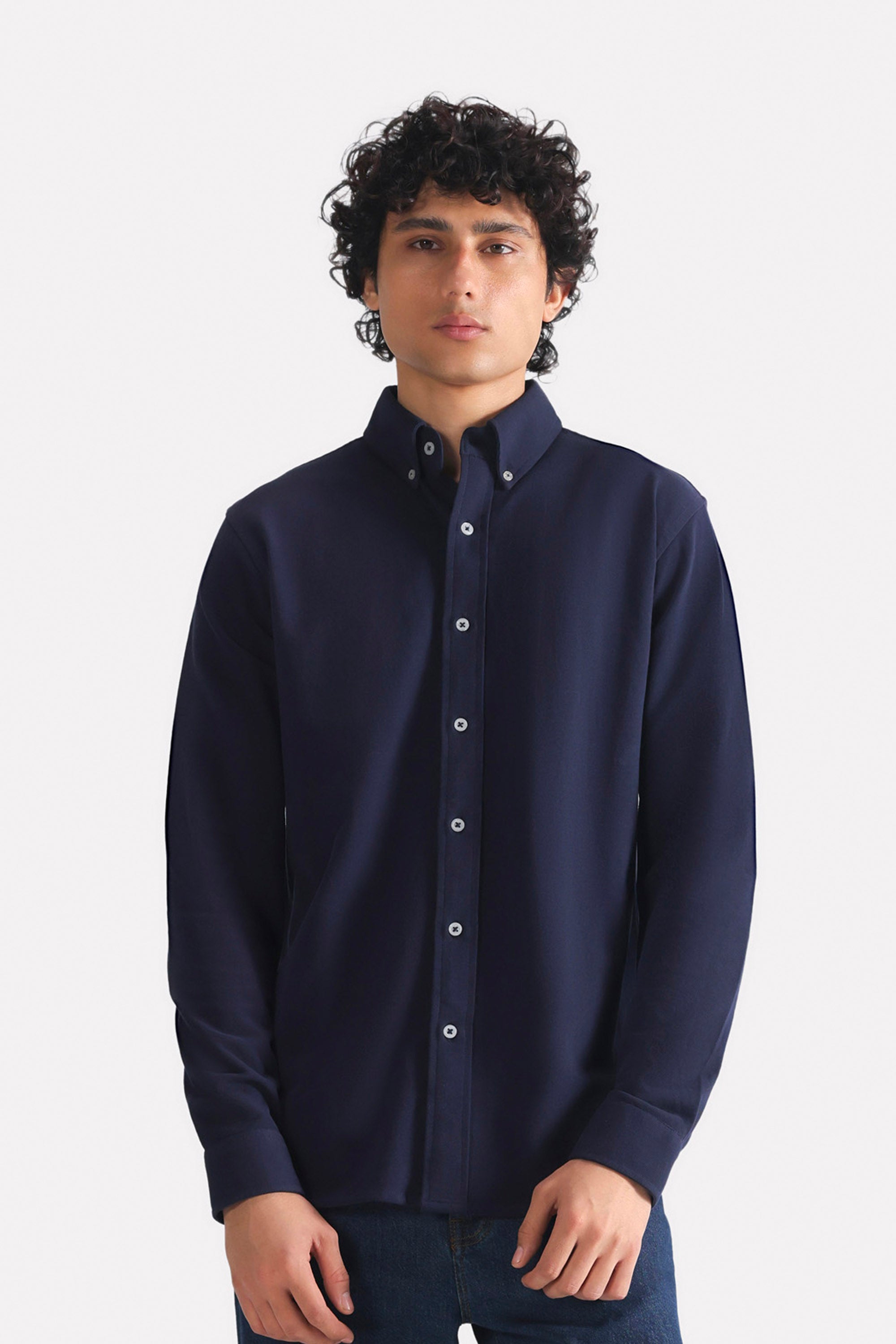 Navy regular fit pique shirt in cotton, worn by a model, by SOLA Pakistan.
