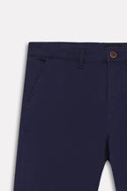 Texture and fabric detail, navy satin straight-fit chino, by SOLA Pakistan.