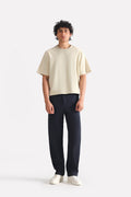 Navy straight fit cotton trouser, worn by a model, by SOLA Pakistan.