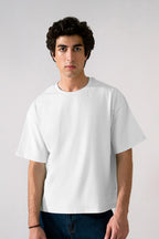 Off-white (cloud dancer) heavy weight cropped t-shirt in cotton, worn by a model, by SOLA Pakistan.