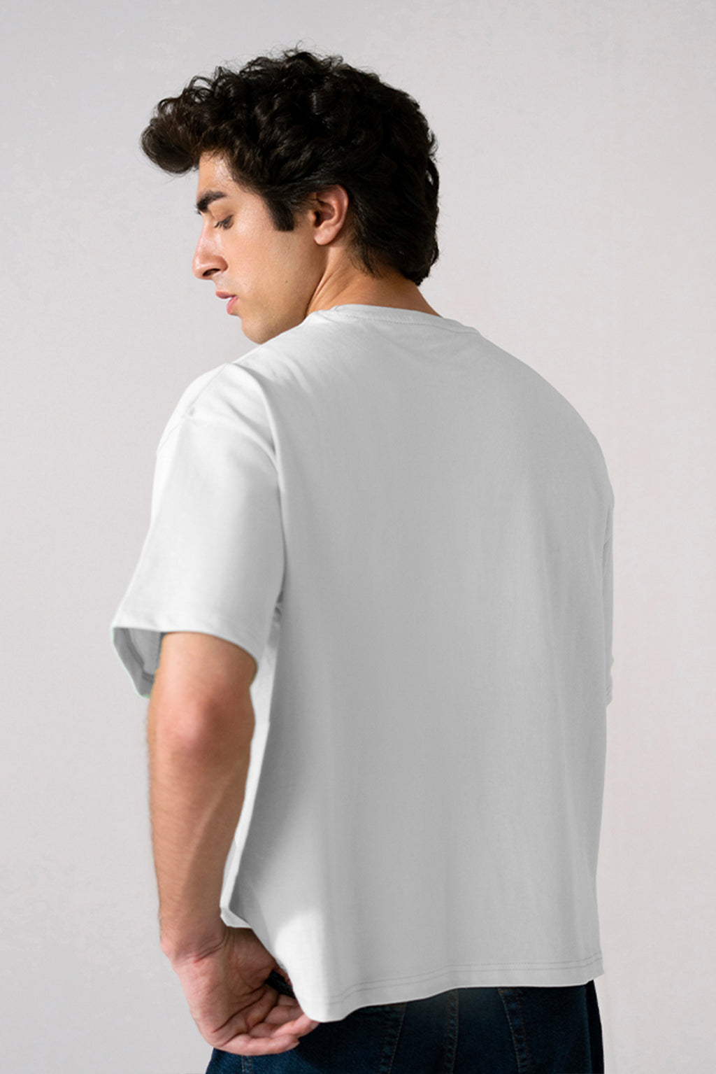 Off-white (cloud dancer) heavy weight cropped t-shirt shown in a styled fit, by SOLA Pakistan.