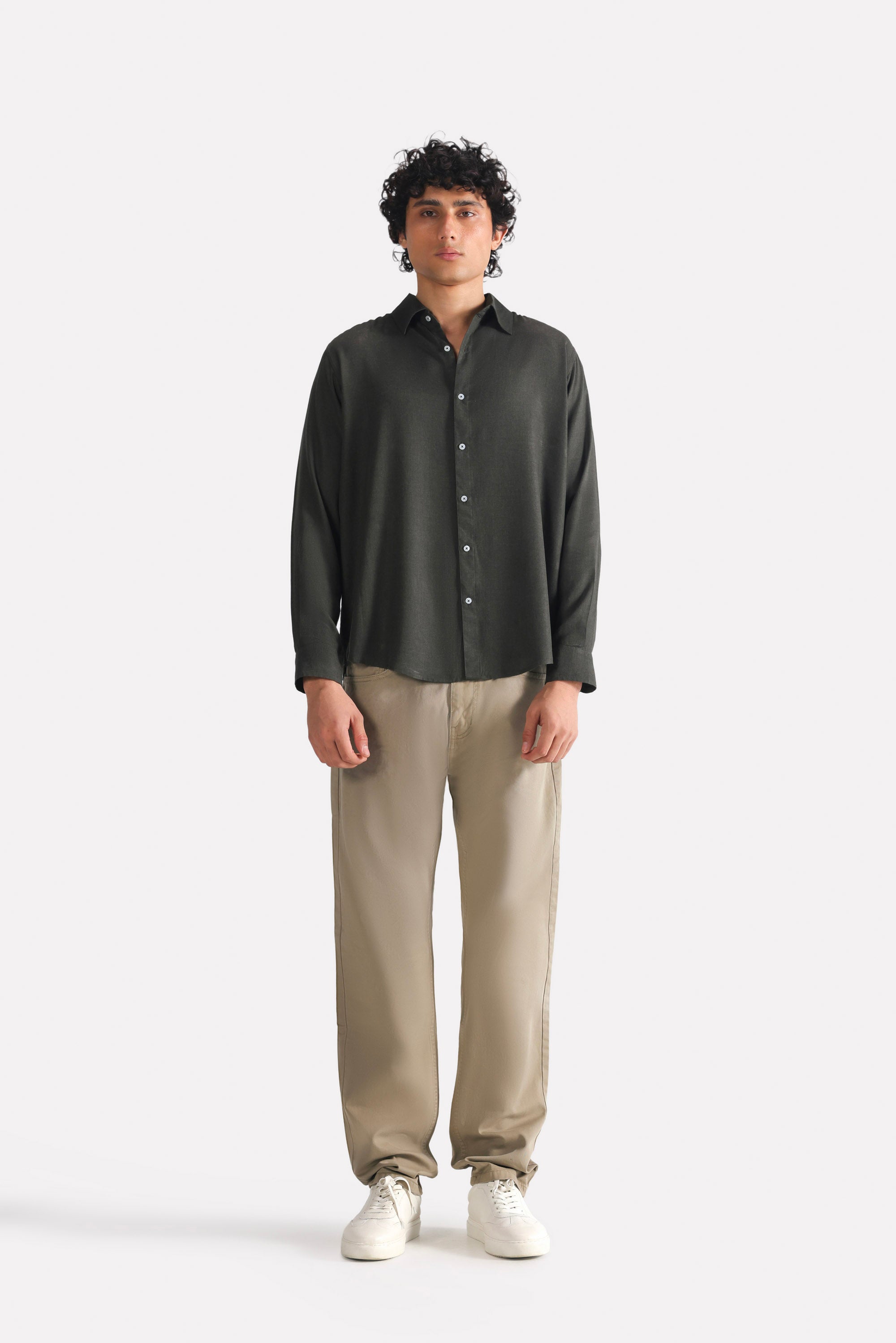 Olive green (autumn green) garment-dyed casual trouser in cotton, worn by a model, by SOLA Pakistan.