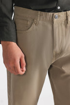 Olive green (autumn green) garment-dyed casual trouser shown in a styled fit, by SOLA Pakistan.