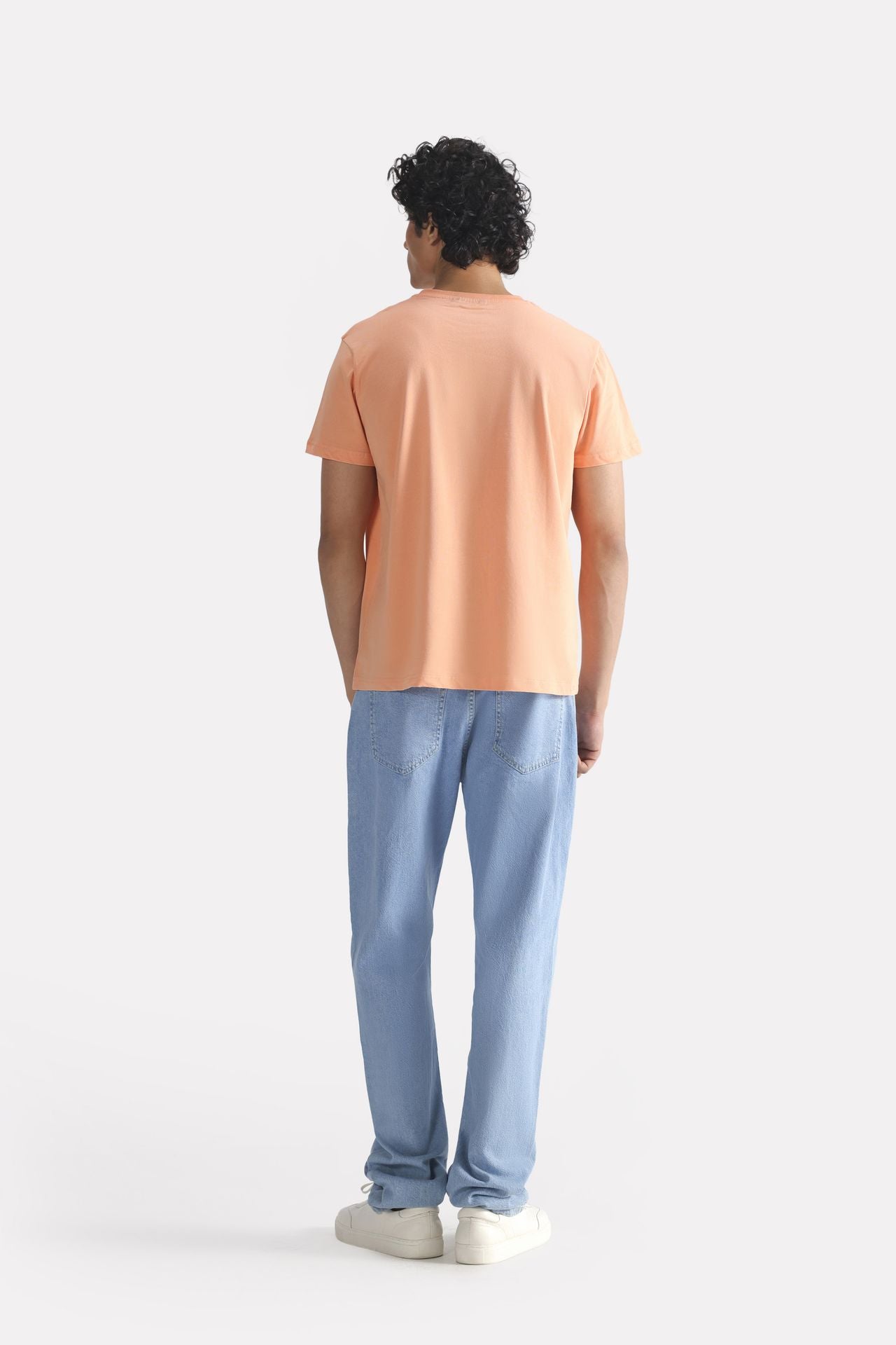 Flat lay of the peach (apricot) regular fit crew neck t-shirt, by SOLA Pakistan.