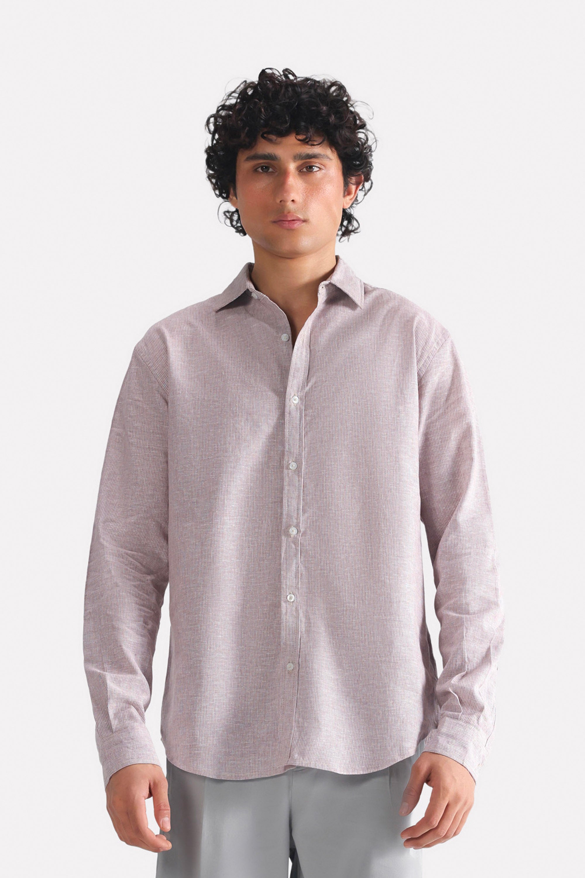 Red cherry stripe relaxed fit striped shirt in cotton-linen blend, worn by a model, by SOLA Pakistan.