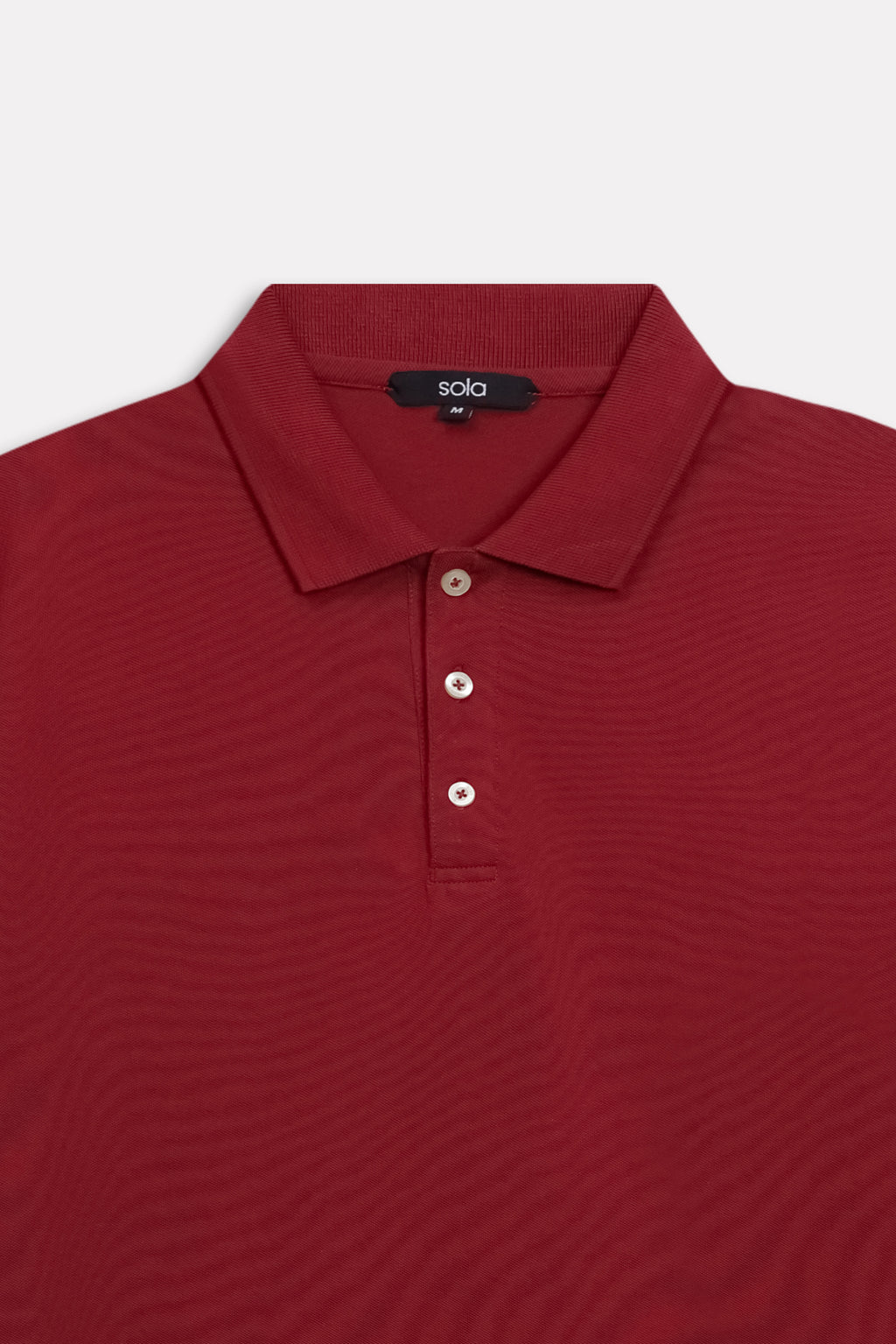 Additional view of the red (red riding hood) micro-textured cotton pique polo, by SOLA Pakistan.