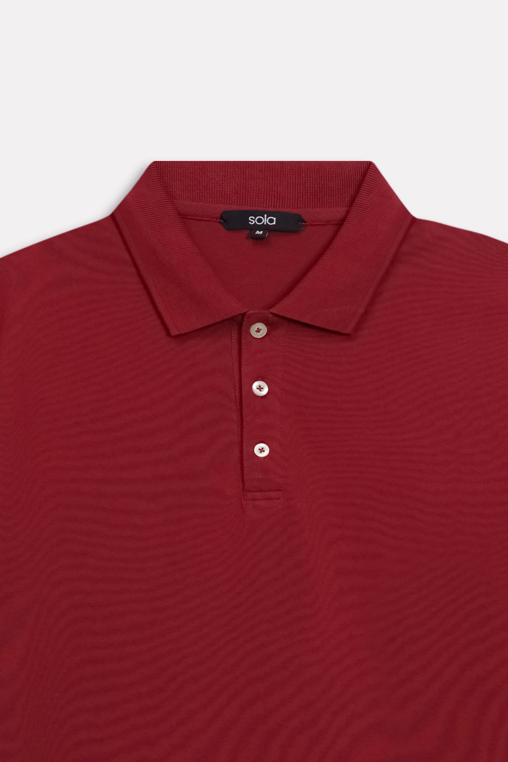 Additional view of the red (red riding hood) micro-textured cotton pique polo, by SOLA Pakistan.