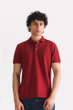 Red (red riding hood) micro-textured cotton pique polo, worn by a model, by SOLA Pakistan.