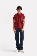 Red (red riding hood) micro-textured cotton pique polo shown in a styled fit, by SOLA Pakistan.